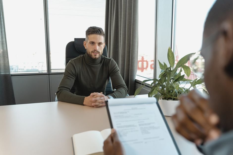 Candidate interviewing for an AI job — proof of skill beats a perfect résumé in this market