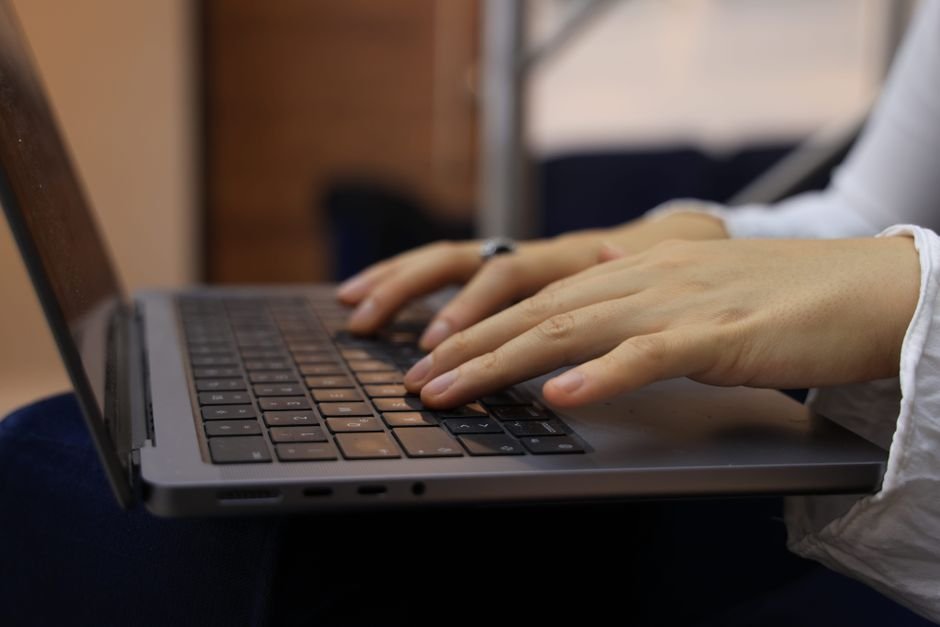 Remote worker completing AI training tasks on a laptop — task-based, desktop-first work