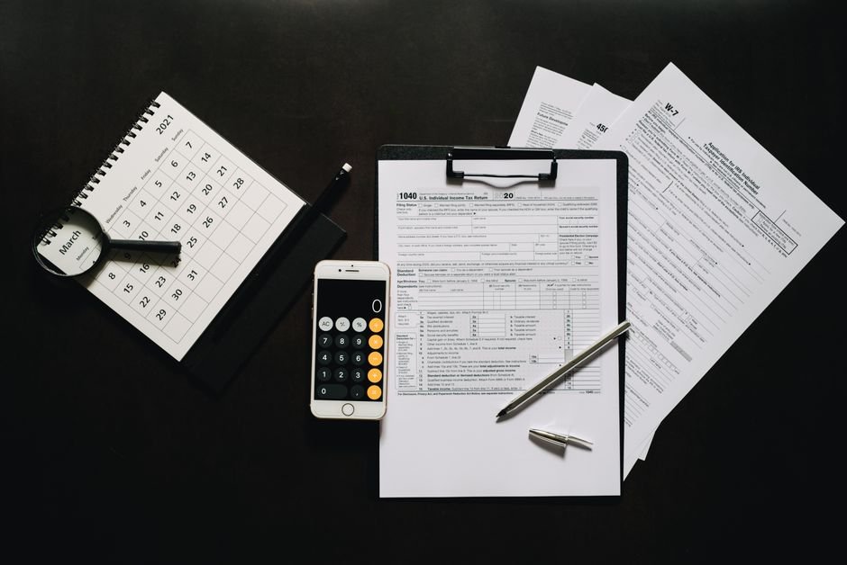 Tax paperwork and a calculator on a desk