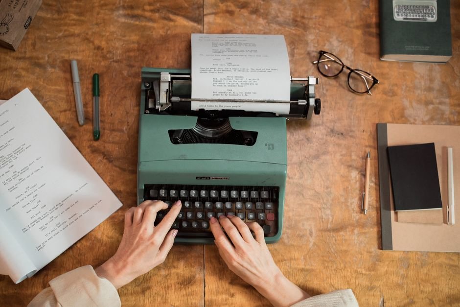 A freelance writer working at a laptop