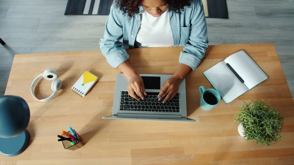 Person working at a home desk on a fellowship project